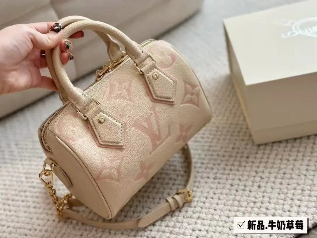 Louis Vuitton LV Speedy Bandouliere 20 Empreinte Leather Handbag Beige and Pink — product photo 1