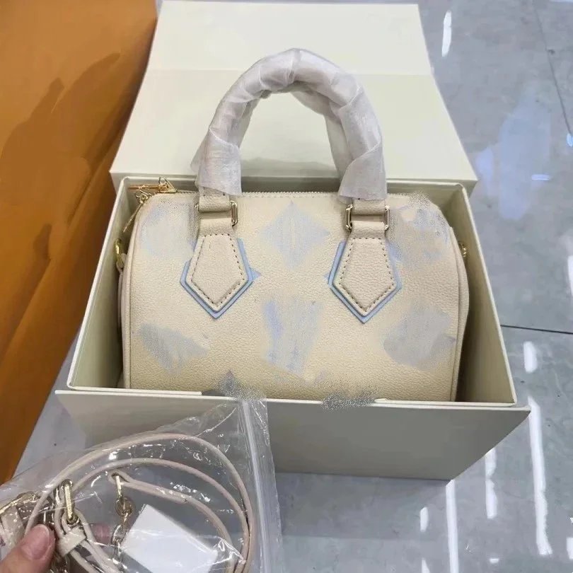 Louis Vuitton LV Speedy Bandouliere 20 Empreinte Leather Handbag Beige and Pink — product photo 2